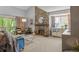Cozy living room with stone fireplace, neutral carpet, and sliding glass doors to the outdoor deck at 4070 S Atchison Way # 304, Aurora, CO 80014