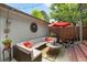 Cozy back patio with comfortable seating, a vibrant umbrella, and stylish decor at 5161 S Emporia Way, Greenwood Village, CO 80111