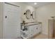 Bathroom with granite countertop, double vanity, and ample storage cabinets at 5161 S Emporia Way, Greenwood Village, CO 80111