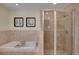 Bright bathroom features a relaxing soaking tub and a glass-enclosed shower at 5161 S Emporia Way, Greenwood Village, CO 80111