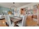 Open dining room with wood floors and a view of the kitchen and living room at 5161 S Emporia Way, Greenwood Village, CO 80111