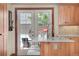 Kitchen island and doors leading to the outside patio with a seating area at 5161 S Emporia Way, Greenwood Village, CO 80111