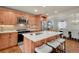Modern kitchen with stainless steel appliances and a marble island with seating at 5161 S Emporia Way, Greenwood Village, CO 80111