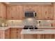 Well-equipped kitchen with stainless steel appliances and custom wood cabinetry at 5161 S Emporia Way, Greenwood Village, CO 80111