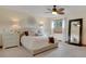 Serene bedroom with plush carpeting, a ceiling fan, and natural light at 5161 S Emporia Way, Greenwood Village, CO 80111
