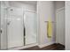 Bathroom featuring a glass shower enclosure with white tile and chrome finishings at 10630 E 26Th Ave, Aurora, CO 80010