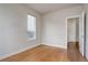 Bedroom with hardwood floors, neutral walls, and a large window offering natural light at 10630 E 26Th Ave, Aurora, CO 80010