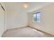 Bright bedroom features a closet and natural light from the window, perfect for relaxation at 11034 W Aqueduct Ln, Littleton, CO 80127