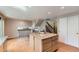 Spacious kitchen featuring an island with granite countertops and modern appliances at 11034 W Aqueduct Ln, Littleton, CO 80127