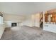 Cozy living room with fireplace and neutral carpet, perfect for entertaining at 11034 W Aqueduct Ln, Littleton, CO 80127