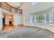 Airy living room showcasing an open floor plan, hardwood floors, and plenty of natural light at 11034 W Aqueduct Ln, Littleton, CO 80127