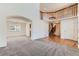Open-concept living space with hardwood floors and a view of the staircase at 11034 W Aqueduct Ln, Littleton, CO 80127