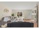 Comfortable living room featuring hardwood floors, stylish decor, and a view out to a bright front yard at 16543 E Kansas Pl, Aurora, CO 80017