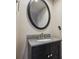Modern bathroom vanity with a granite countertop and black trim vanity mirror at 1953 E 102Nd Cir, Thornton, CO 80229