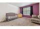 Well-lit Bedroom with a grey crib, dresser, day bed, and a window at 1953 E 102Nd Cir, Thornton, CO 80229