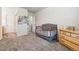 Bright Bedroom with grey crib, a dresser and view of the hallway and bathroom at 1953 E 102Nd Cir, Thornton, CO 80229