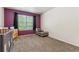 Cozy Bedroom with purple accent wall, crib, daybed and window at 1953 E 102Nd Cir, Thornton, CO 80229