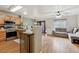 Bright living space featuring a well-equipped kitchen, a cozy dining area, and a comfortable living area at 1953 E 102Nd Cir, Thornton, CO 80229