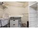 Walk-in closet converted to a Bedroom with shelves, changing table and crib at 1953 E 102Nd Cir, Thornton, CO 80229
