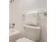 Bright bathroom features white tile, toilet, and shower/tub at 1020 15Th St # 20F, Denver, CO 80202