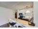 Kitchen bar with marble countertops and black appliances at 1020 15Th St # 20F, Denver, CO 80202