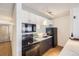 Bright kitchen features white and gray cabinets, black appliances, and a breakfast bar at 1020 15Th St # 20F, Denver, CO 80202