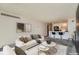 Comfortable living room with view to kitchen bar and access to storage at 1020 15Th St # 20F, Denver, CO 80202