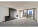 Bright living room with neutral carpet and walk out balcony at 1020 15Th St # 20F, Denver, CO 80202