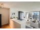 Living room area with built in storage and city views at 1020 15Th St # 20F, Denver, CO 80202