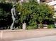 Statue of a miner next to well-maintained landscaping with trees, shrubs, and blooming flowers at 1020 15Th St # 20F, Denver, CO 80202