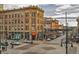 Charming street view with historic buildings, sidewalk cafes, and pedestrian activity at 1020 15Th St # 20F, Denver, CO 80202