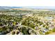 An aerial view shows the neighborhood and the home's convenient location near highways and local amenities at 57 Mc Intyre Cir, Golden, CO 80401