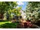This lovely home features a charming backyard with a deck and a cozy outdoor seating area at 57 Mc Intyre Cir, Golden, CO 80401
