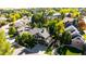 Charming home exterior with lush landscaping, a well-maintained yard, and a welcoming curb appeal in a treed community at 57 Mc Intyre Cir, Golden, CO 80401