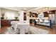 Spacious eat-in kitchen with stainless steel appliances, dark wood cabinets, and counter seating at 57 Mc Intyre Cir, Golden, CO 80401