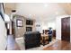 Cozy living room with a stone fireplace, dark wood accents, and comfortable seating at 57 Mc Intyre Cir, Golden, CO 80401