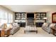 Bright and comfortable living room features built-in shelving and a fireplace at 57 Mc Intyre Cir, Golden, CO 80401