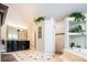 Spacious bathroom featuring tile flooring, a walk-in shower, large mirror, and dual sinks at 57 Mc Intyre Cir, Golden, CO 80401