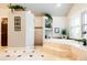 Luxurious bathroom featuring tile flooring, a soaking tub, walk-in shower, and plenty of natural light at 57 Mc Intyre Cir, Golden, CO 80401