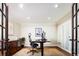 Bright home office features hardwood floors, french doors, and custom built-ins at 57 Mc Intyre Cir, Golden, CO 80401