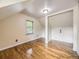 A bedroom featuring hardwood floors, a window, and additional space for storage at 5339 S Windermere St, Littleton, CO 80120