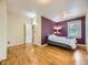 Comfortable bedroom with hardwood floors, a bed, and a window for natural light at 5339 S Windermere St, Littleton, CO 80120
