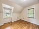 Bright bedroom with hardwood floors and two windows providing ample natural light at 5339 S Windermere St, Littleton, CO 80120