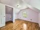 A bedroom with hardwood floors and a door that leads to an extra space or closet at 5339 S Windermere St, Littleton, CO 80120