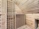 Unique wine cellar space with custom wooden racks and sloped ceiling, perfect for wine enthusiasts at 5339 S Windermere St, Littleton, CO 80120
