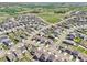 Neighborhood aerial view showcases the property's prime location with surrounding homes, green spaces, and convenient street access at 1846 Osprey Dr, Brighton, CO 80601