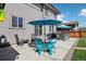 Spacious backyard featuring patio seating, lush lawn, and outdoor entertaining space at 1846 Osprey Dr, Brighton, CO 80601