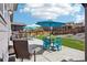 Inviting backyard with patio, seating, and well-maintained landscaping at 1846 Osprey Dr, Brighton, CO 80601