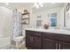 Well-lit bathroom with double vanity, shower and tub combo, and fresh decor at 1846 Osprey Dr, Brighton, CO 80601
