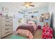 Charming bedroom with natural light, playful decor, and stylish ' furniture at 1846 Osprey Dr, Brighton, CO 80601
